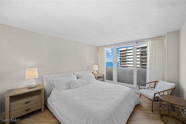 bedroom featuring light wood-type flooring