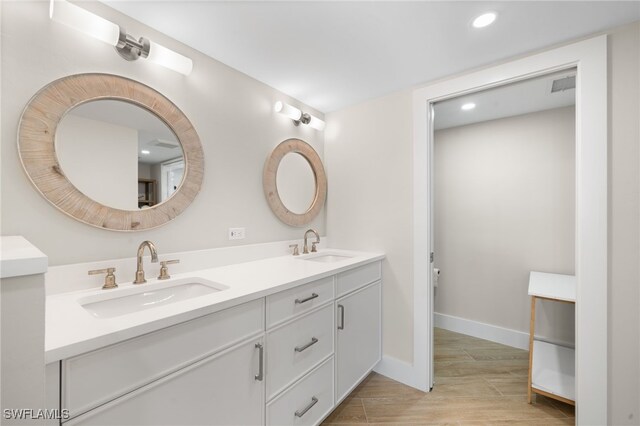 bathroom featuring vanity and wood-type flooring