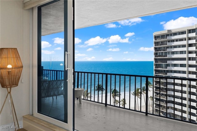 balcony featuring a water view