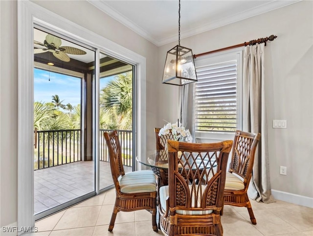 dining space with ceiling fan, plenty of natural light, light tile patterned floors, and ornamental molding