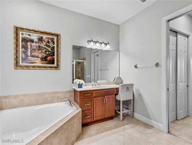 bathroom with tile patterned floors, separate shower and tub, and vanity