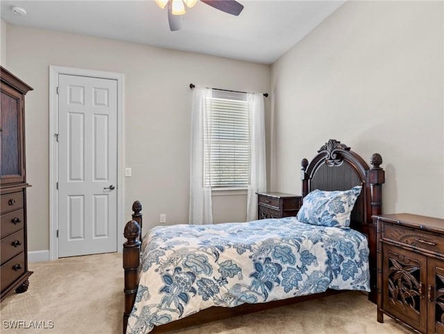 carpeted bedroom featuring ceiling fan