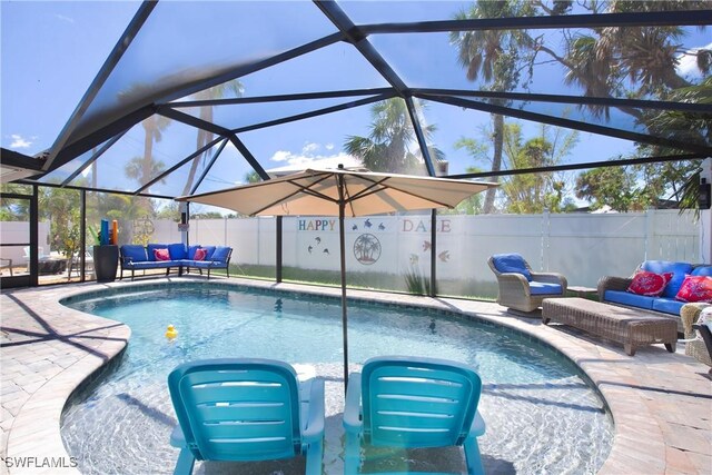 view of swimming pool with glass enclosure, an outdoor living space, and a patio area