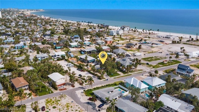 drone / aerial view with a water view and a residential view