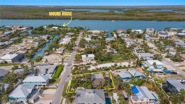 birds eye view of property featuring a residential view and a water view