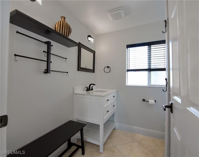 bathroom featuring tile patterned flooring and vanity