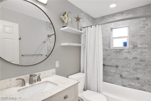 full bathroom featuring vanity, toilet, and shower / bath combo with shower curtain