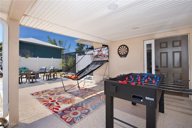 game room featuring speckled floor