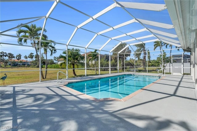 view of pool featuring glass enclosure and a patio