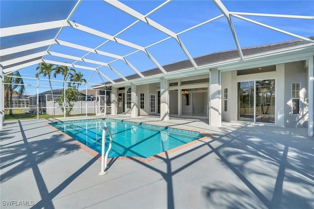 view of pool with a lanai and a patio