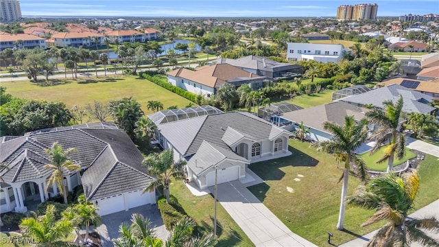 birds eye view of property with a water view