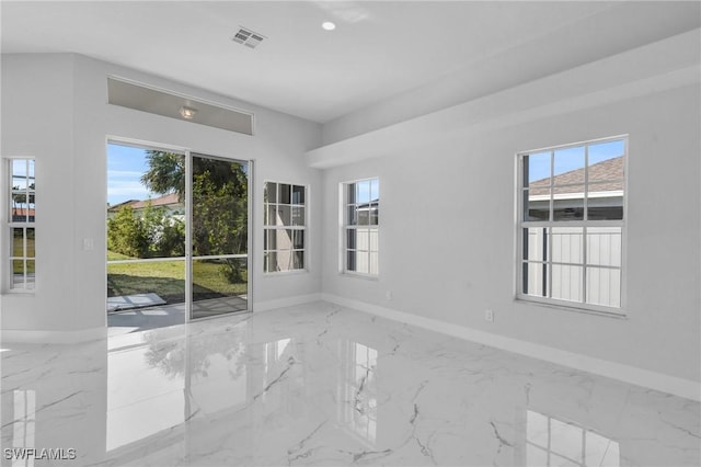 empty room featuring a wealth of natural light