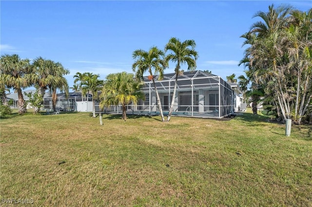 view of yard with a lanai