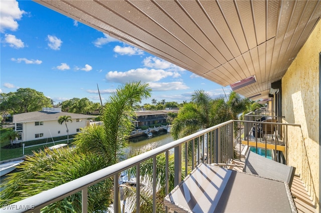 balcony featuring a water view