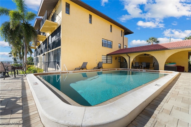 view of pool featuring a patio