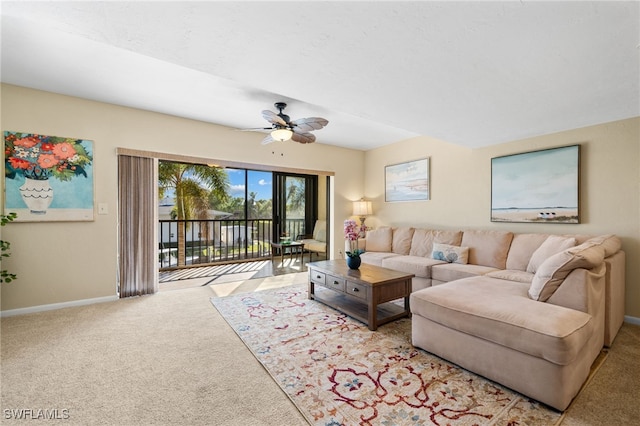 carpeted living room featuring ceiling fan