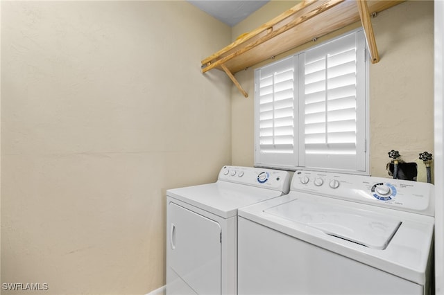 laundry room with separate washer and dryer