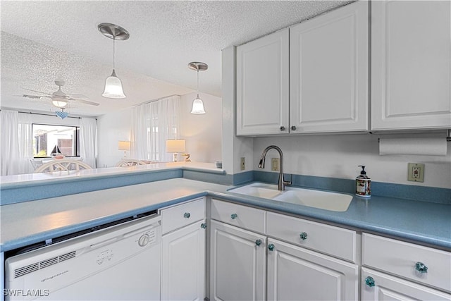 kitchen featuring ceiling fan, sink, white cabinets, and white dishwasher