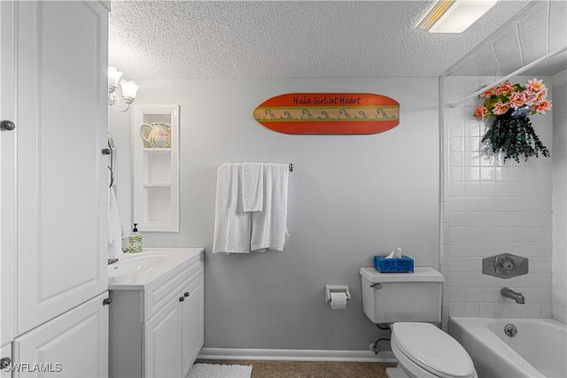 full bathroom featuring vanity, toilet, a textured ceiling, and tiled shower / bath combo