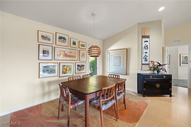 dining area featuring lofted ceiling