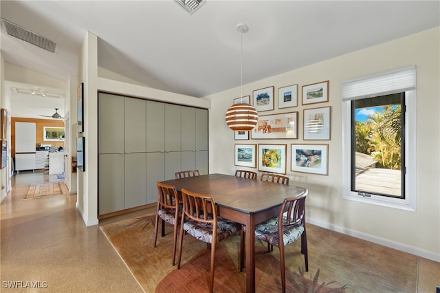 dining area with ceiling fan and lofted ceiling