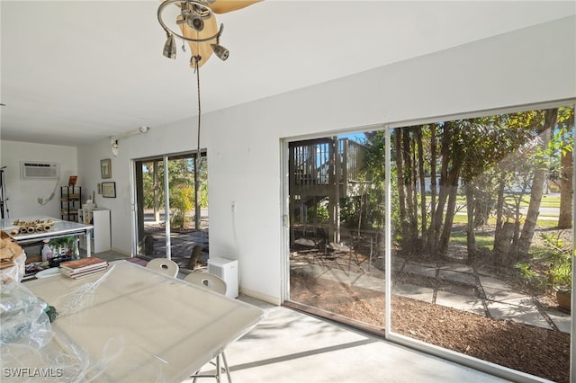 dining room with a wall mounted air conditioner