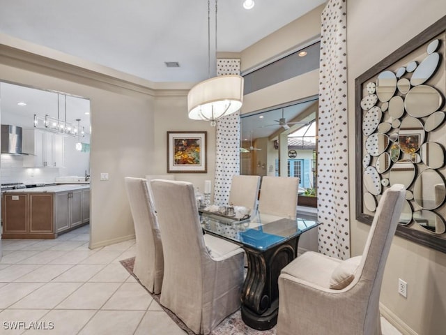 dining room featuring light tile patterned floors and ceiling fan