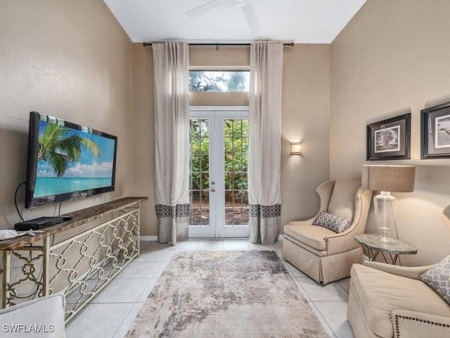 living area featuring light tile patterned floors and french doors