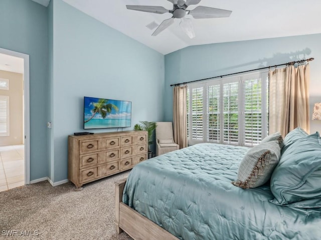 bedroom with lofted ceiling, ceiling fan, and carpet