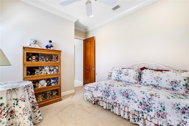 carpeted bedroom with ceiling fan and ornamental molding