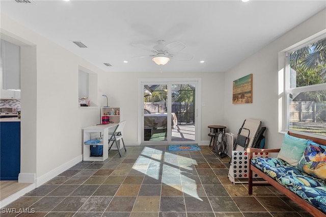 living area featuring ceiling fan