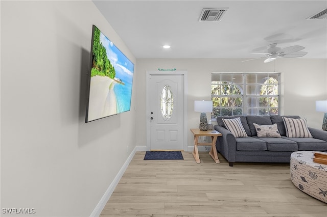 foyer featuring ceiling fan and light wood-type flooring