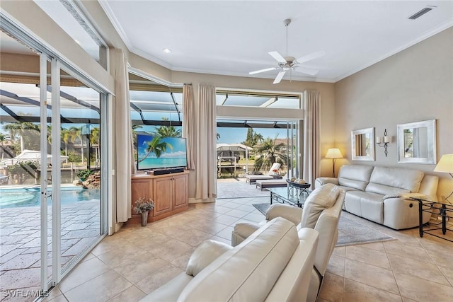 living room featuring ceiling fan, light tile patterned floors, and ornamental molding