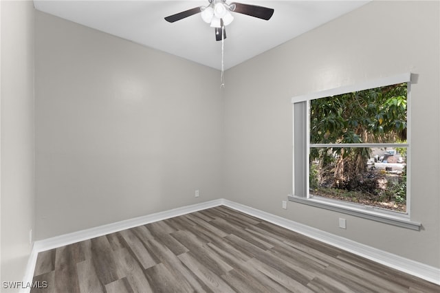 spare room with ceiling fan and wood-type flooring