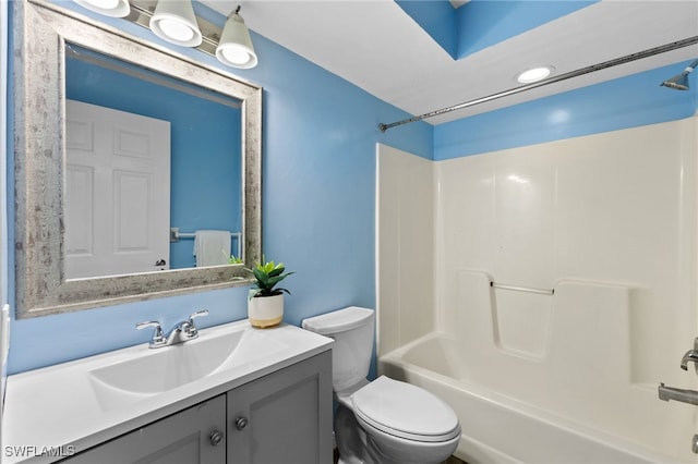 full bathroom with bathtub / shower combination, vanity, and toilet