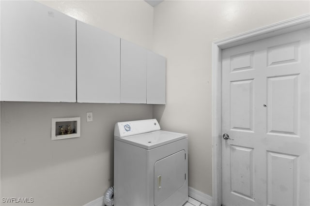 laundry room featuring cabinets and washer / clothes dryer