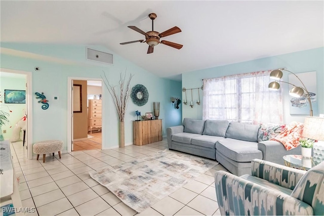 tiled living room with ceiling fan and lofted ceiling