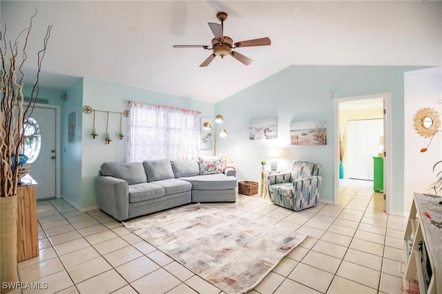 living room featuring ceiling fan, light tile patterned flooring, and vaulted ceiling