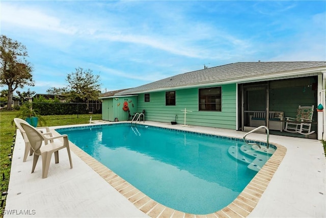 view of swimming pool featuring a patio area