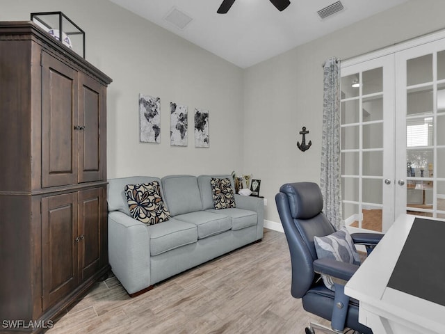 office area featuring ceiling fan, visible vents, baseboards, light wood-style floors, and french doors