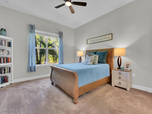 bedroom with baseboards, a ceiling fan, and light colored carpet