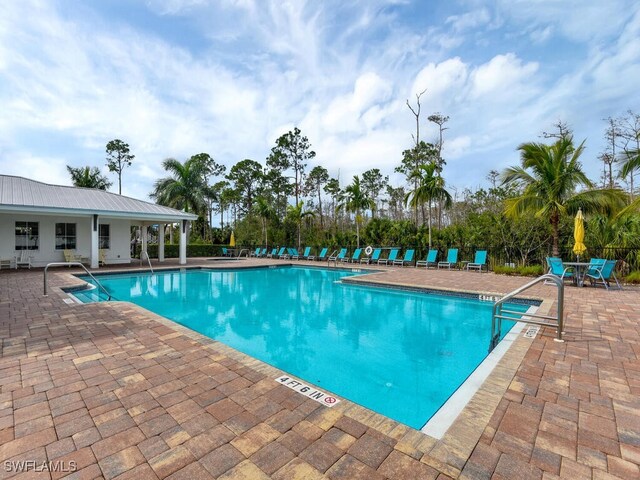 pool featuring a patio area