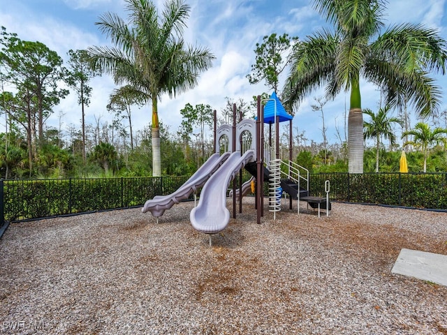 community jungle gym featuring fence