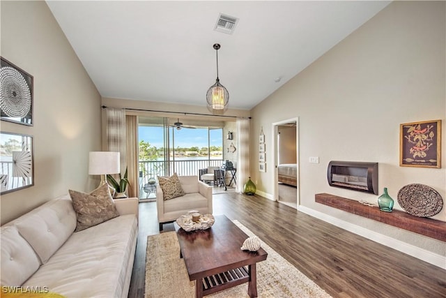 living room with hardwood / wood-style floors and vaulted ceiling