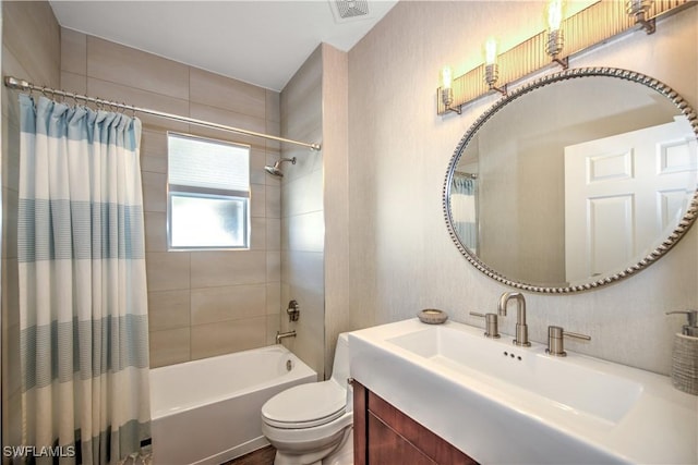 full bathroom with shower / bath combo with shower curtain, vanity, and toilet