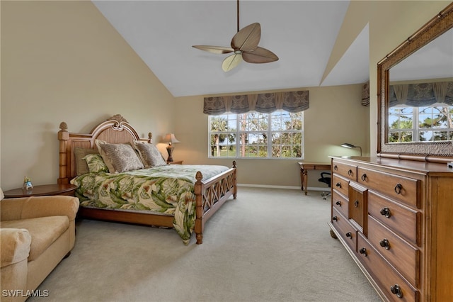 carpeted bedroom featuring multiple windows, ceiling fan, and vaulted ceiling