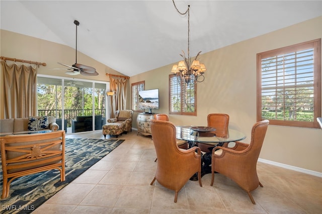 tiled dining area with plenty of natural light, ceiling fan with notable chandelier, and lofted ceiling