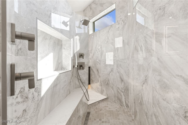 bathroom featuring tiled shower