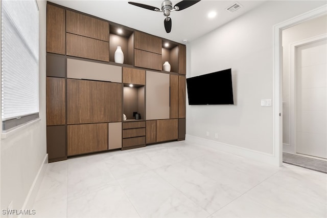 interior space featuring ceiling fan