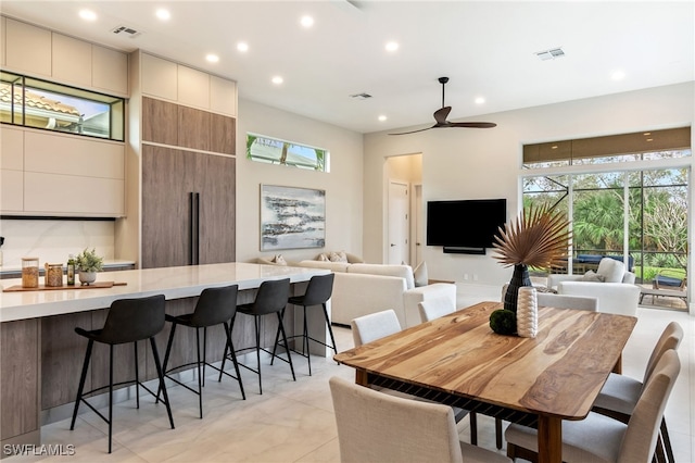 dining space with ceiling fan